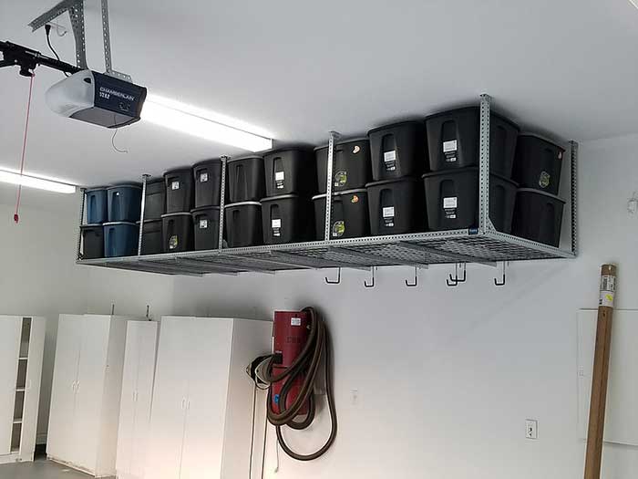 Smart Racks' ceiling rack is installed in an Orlando, FL, garage for extra storage space