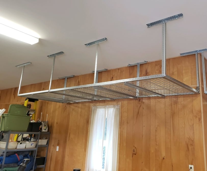 Garage overhead storage rack installation in Orlando, FL maximizing ceiling space and organization