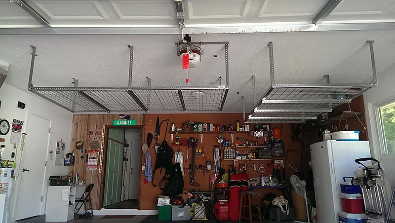 Double ceiling mounted storage racks installed in Orlando, FL for efficient garage organization